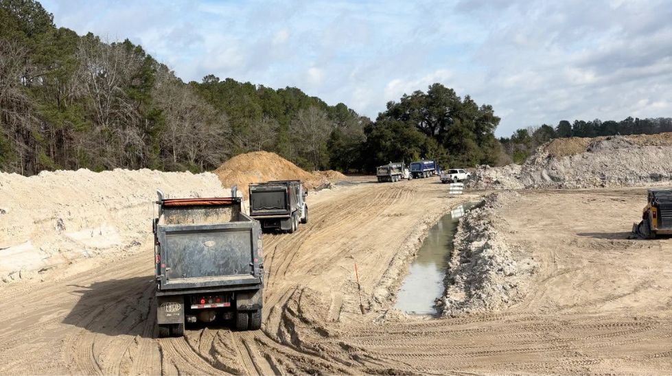 Debris hauling truck removing dirt and construction waste